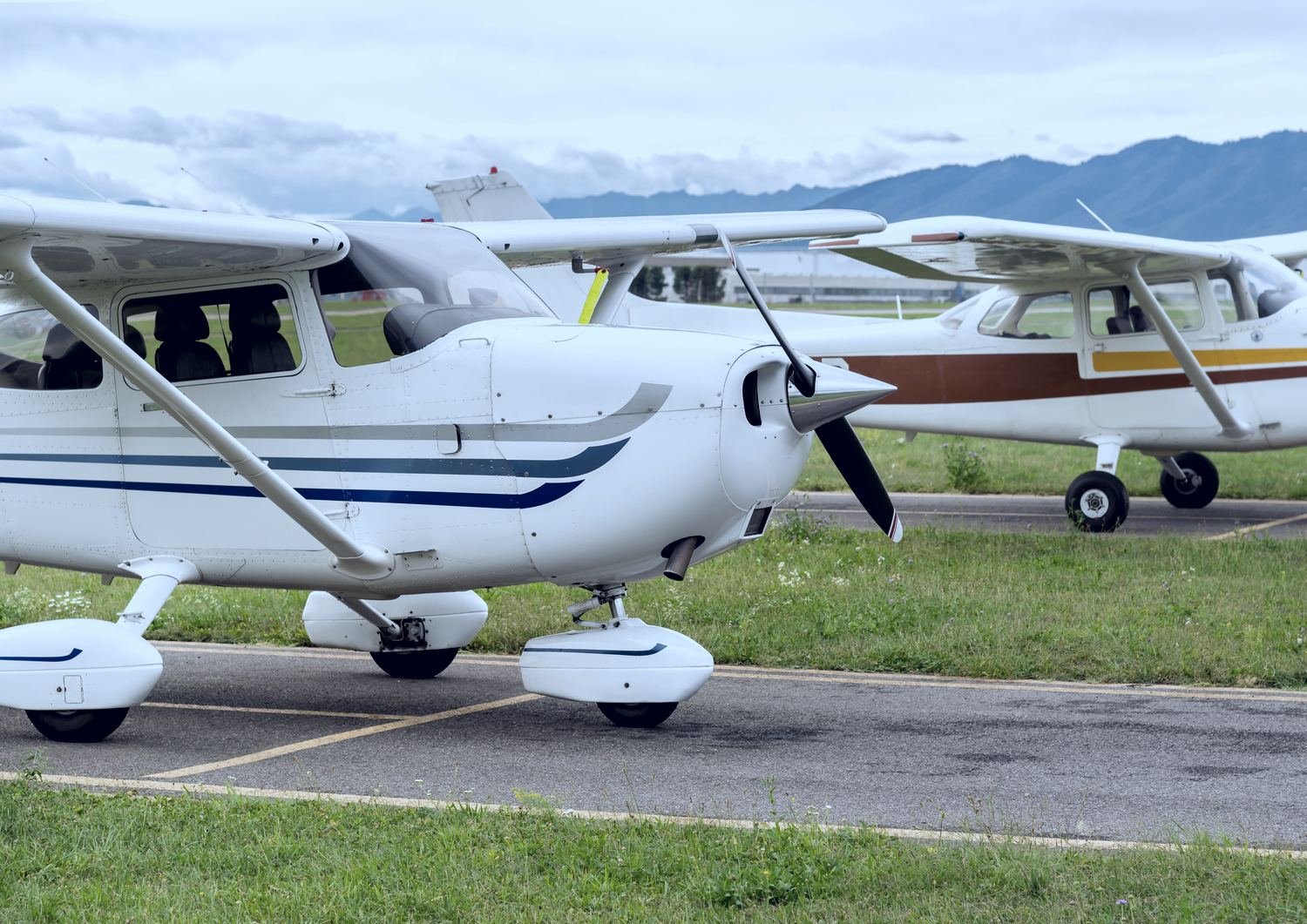 Single engine piston aircraft on a grass field