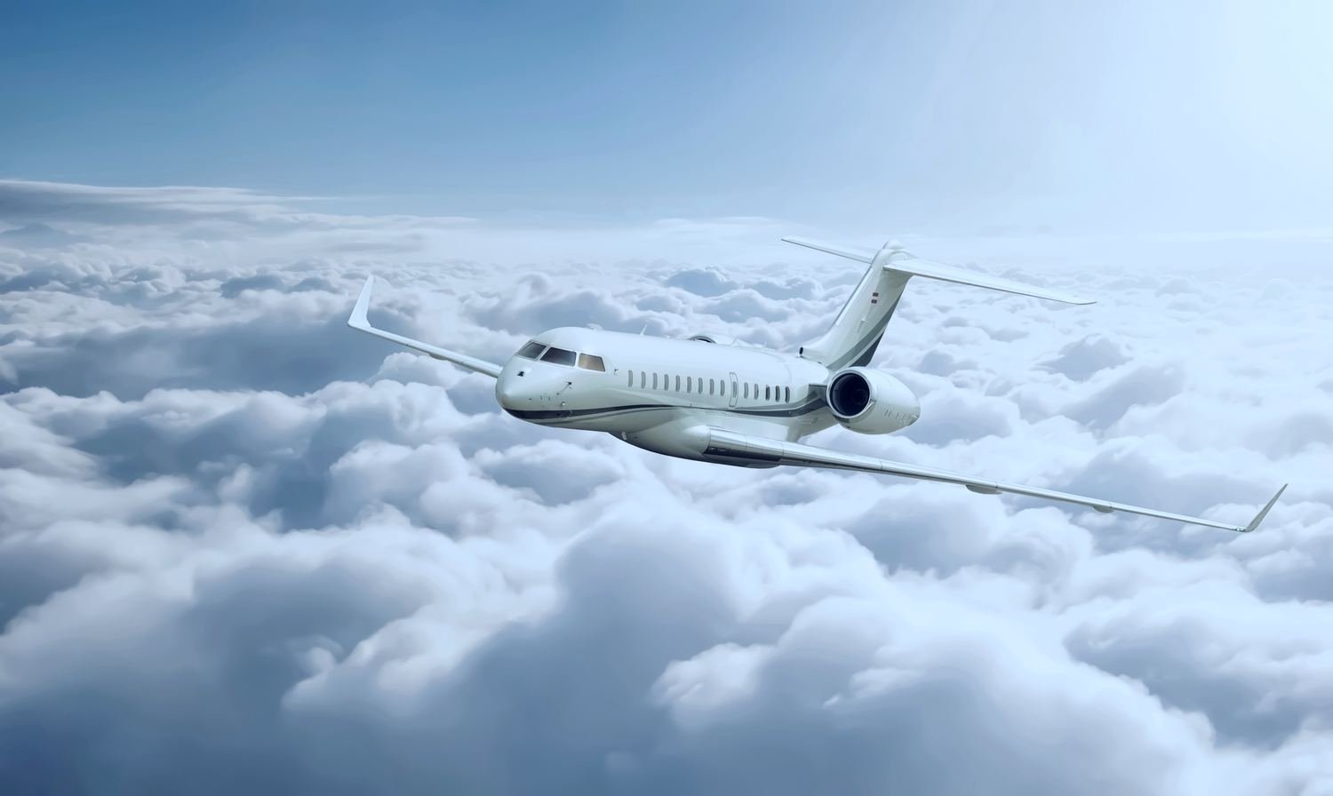 Ultra long range business jet in flight above cloud